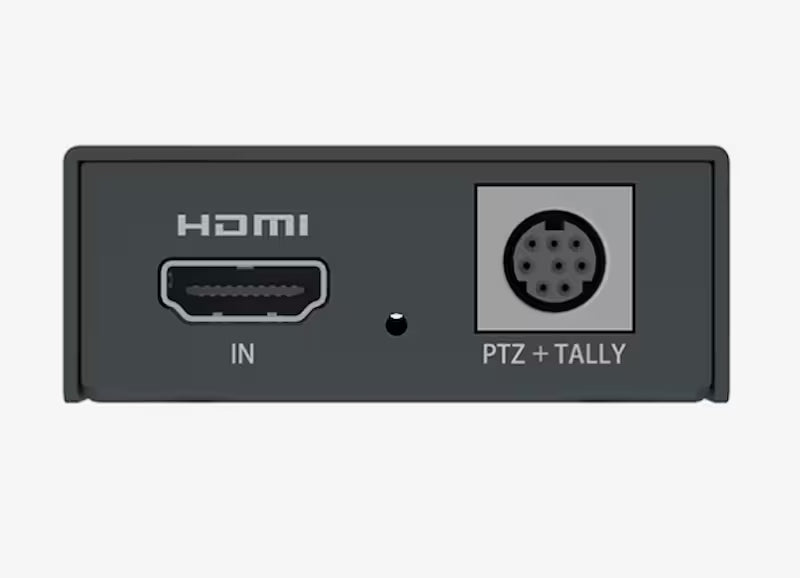 A close-up of a dark gray electronic device showing its rear panel with an HDMI IN port and a PTZ + TALLY port on a light gray background.